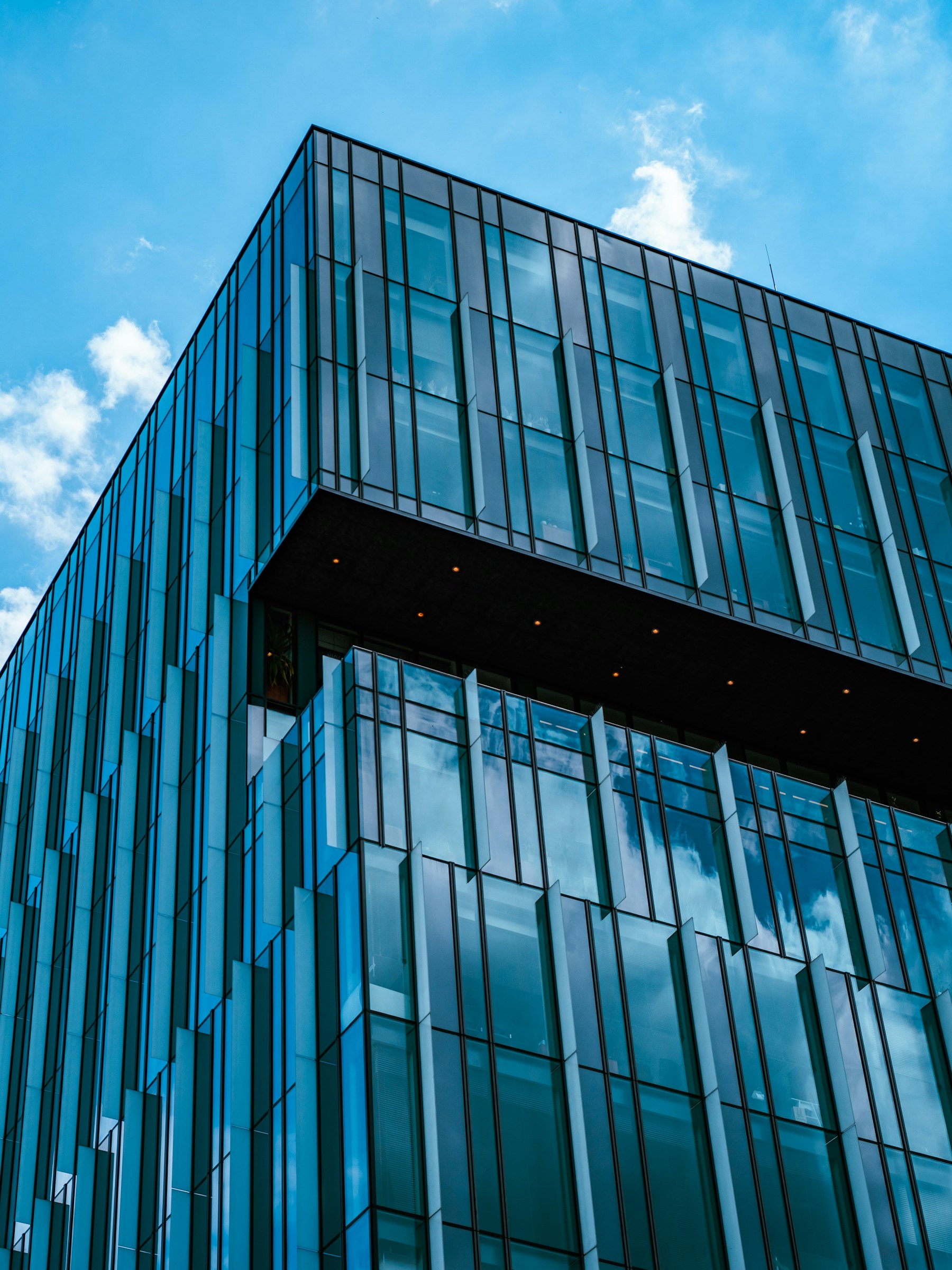Modern commercial architecture with a geometric glass facade